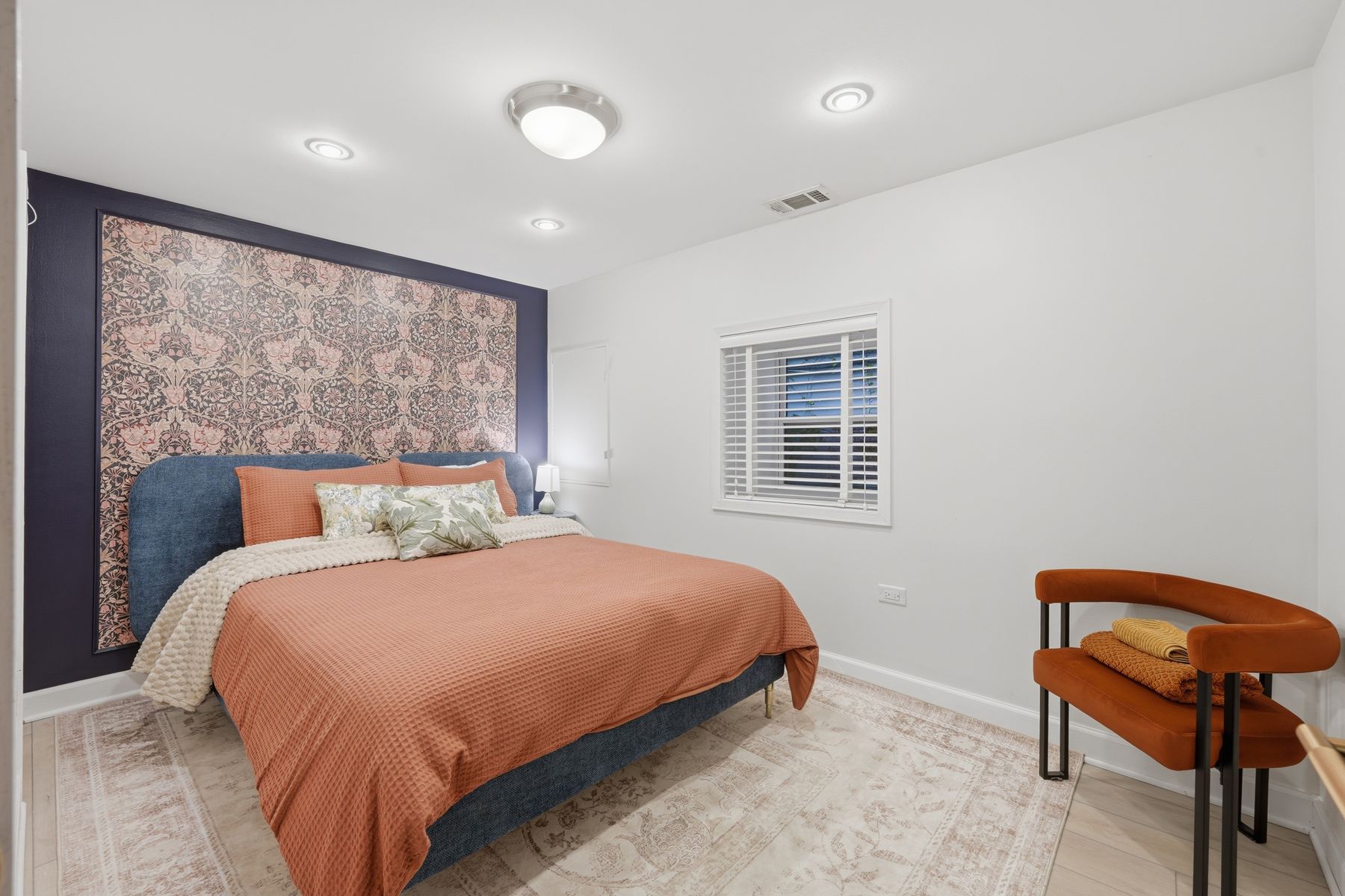Bedroom with a patterned accent wall