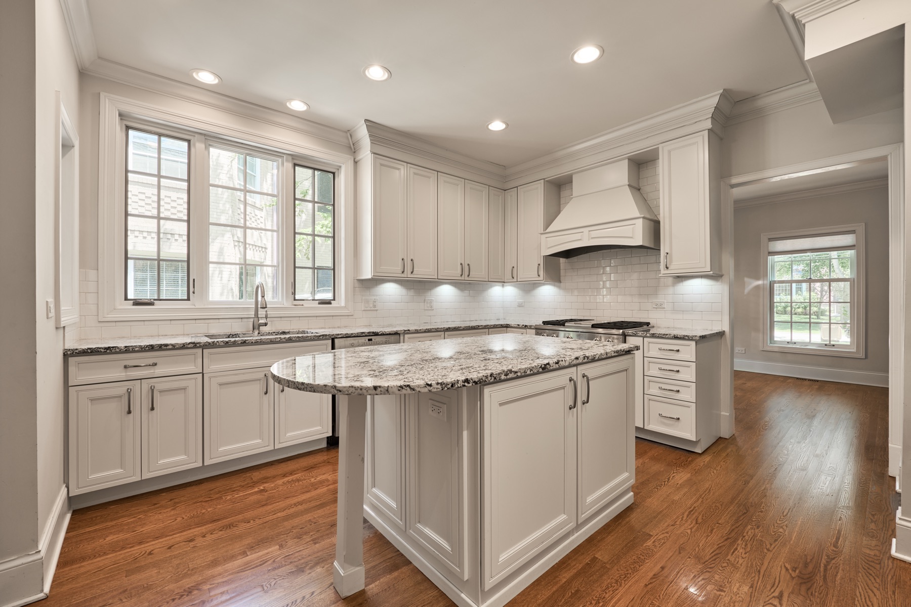 A kitchen with a granite island